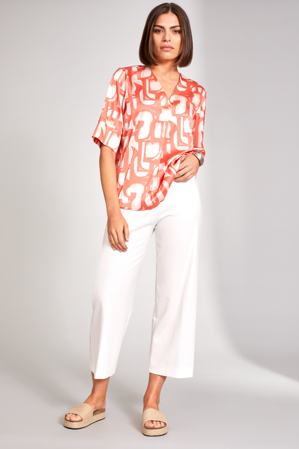 Orange V-Neck Silk Feel Top with Cream Print