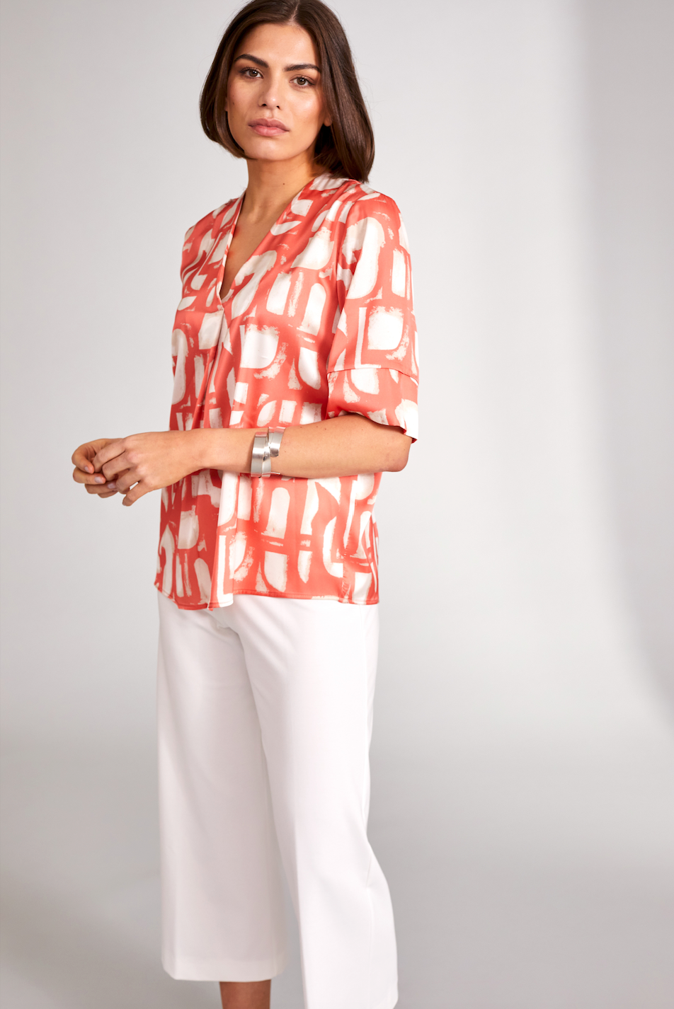 Orange V-Neck Silk Feel Top with Cream Print