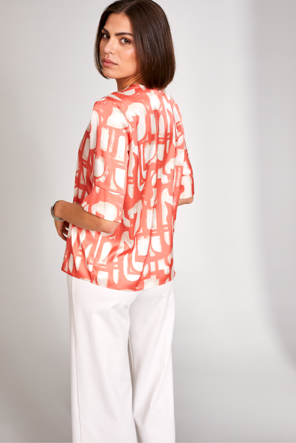 Orange V-Neck Silk Feel Top with Cream Print