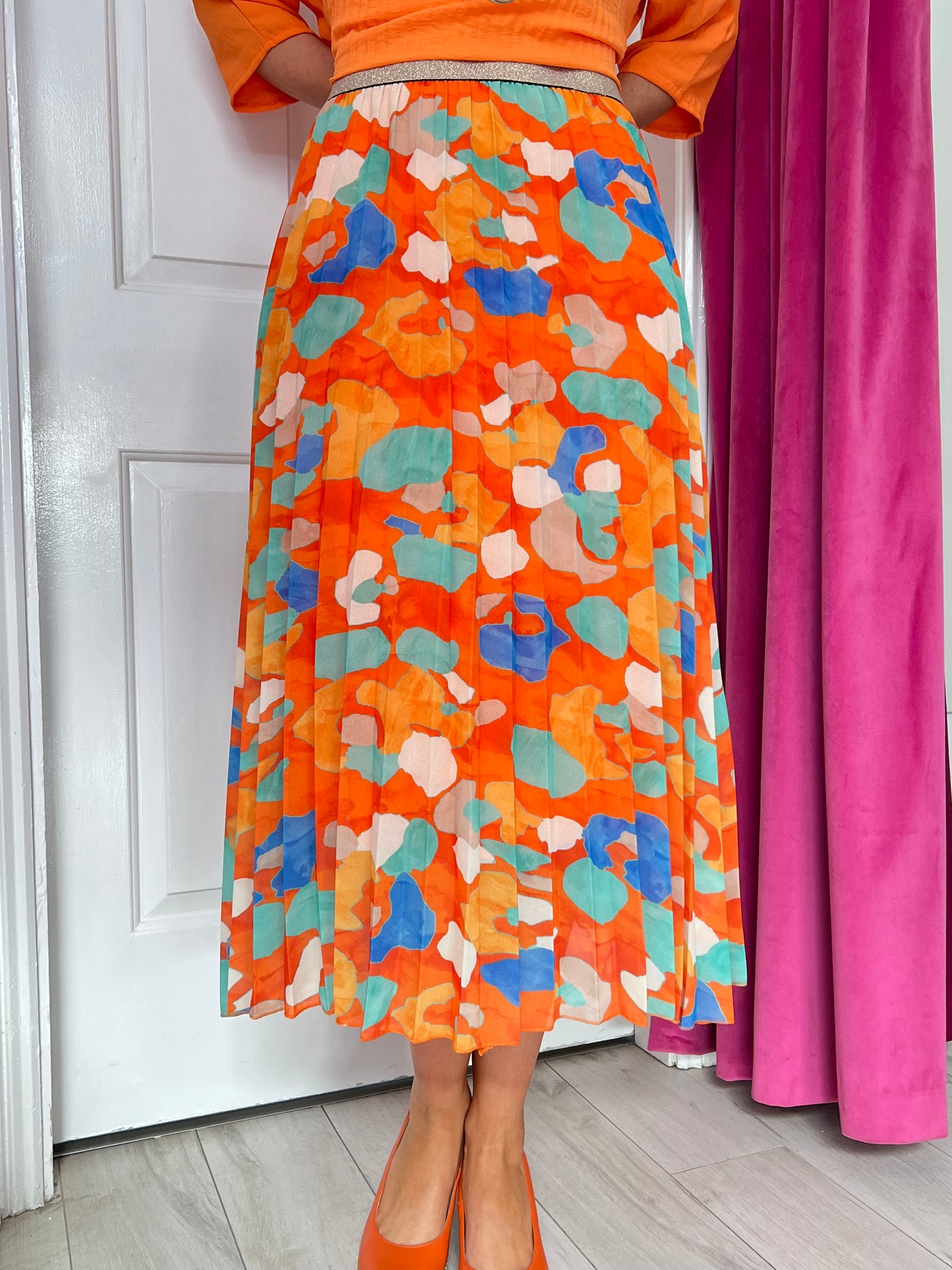 Orange Printed Pleated Skirt with Glitter Waist Band